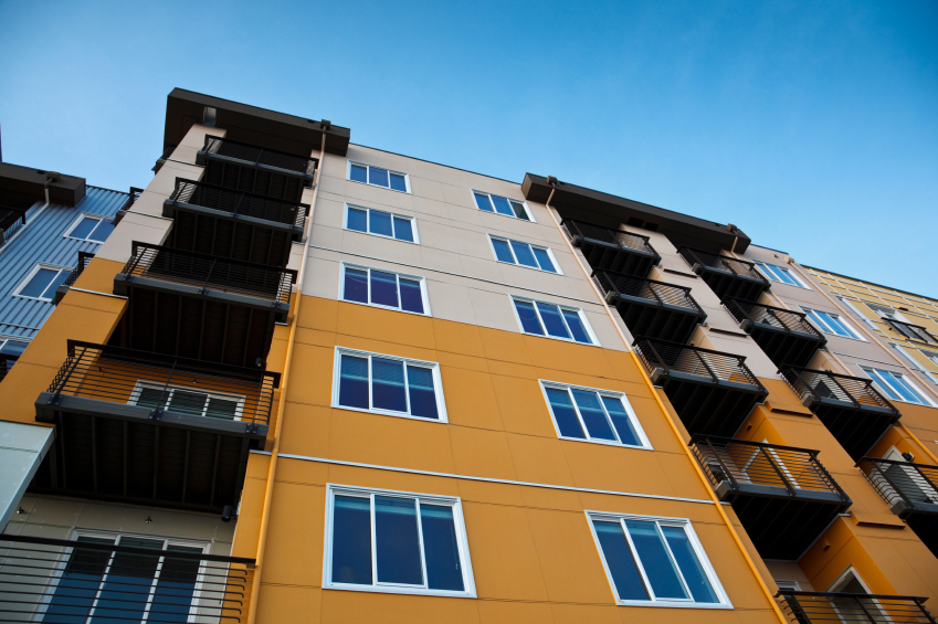 Orange condo bldg James Tjoa & Associates RE/MAX Metro Realty James